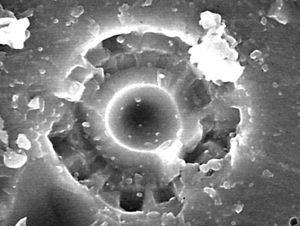 0.01mm microcrater on lunar glass.jpg